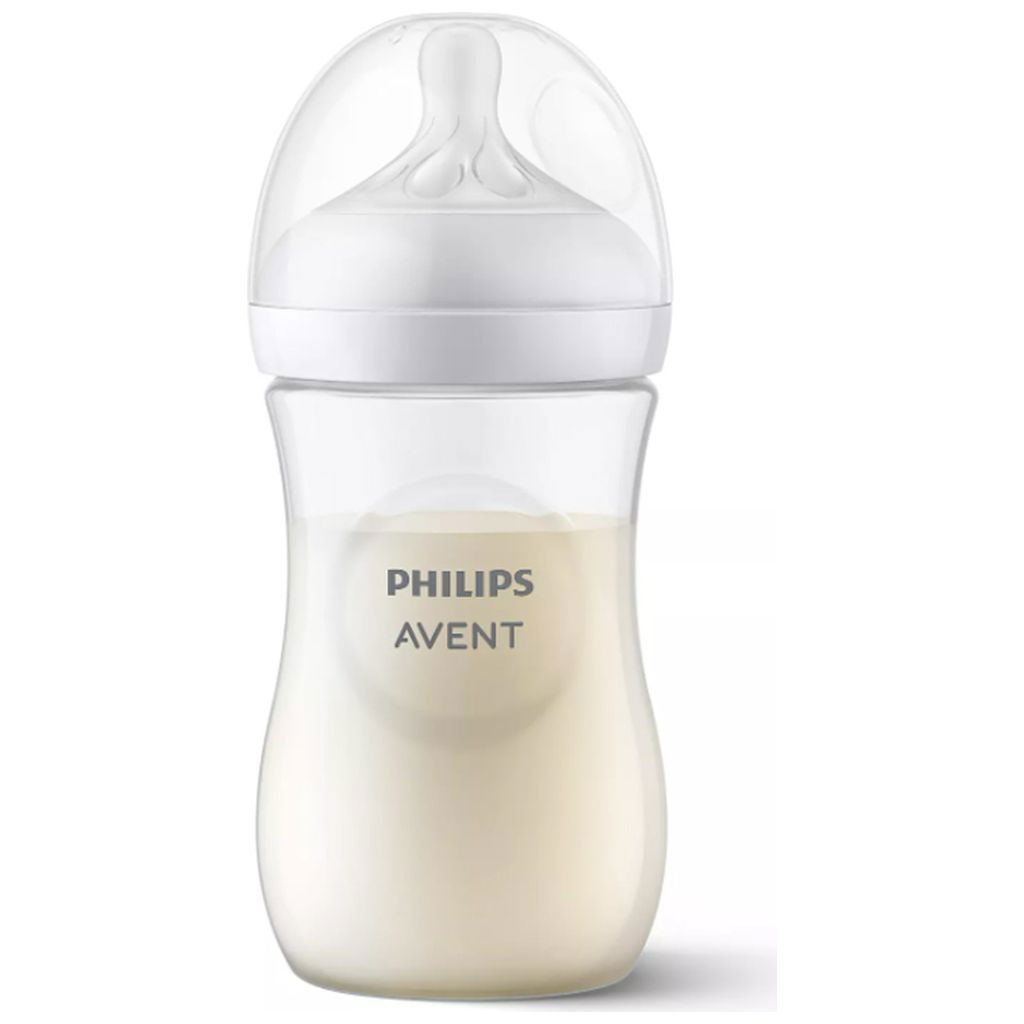 Transparente Babyflasche mit Milch und weissem Sauger