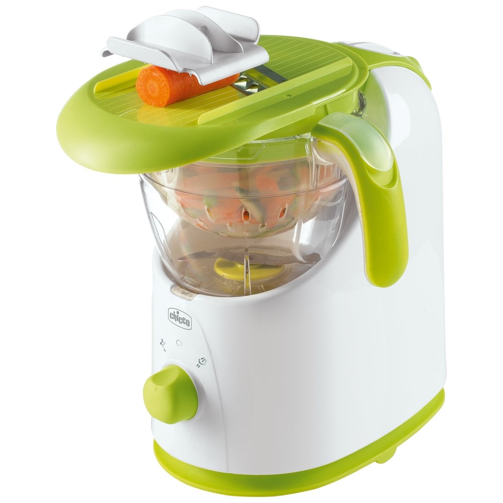 Weisses Küchengerät mit grünem Gemüseschneider und Karotte