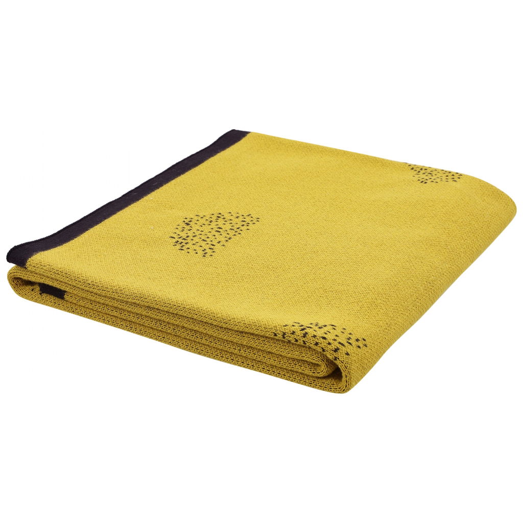 Gefaltete gelbe Babydecke mit dunklem Rand und Muster